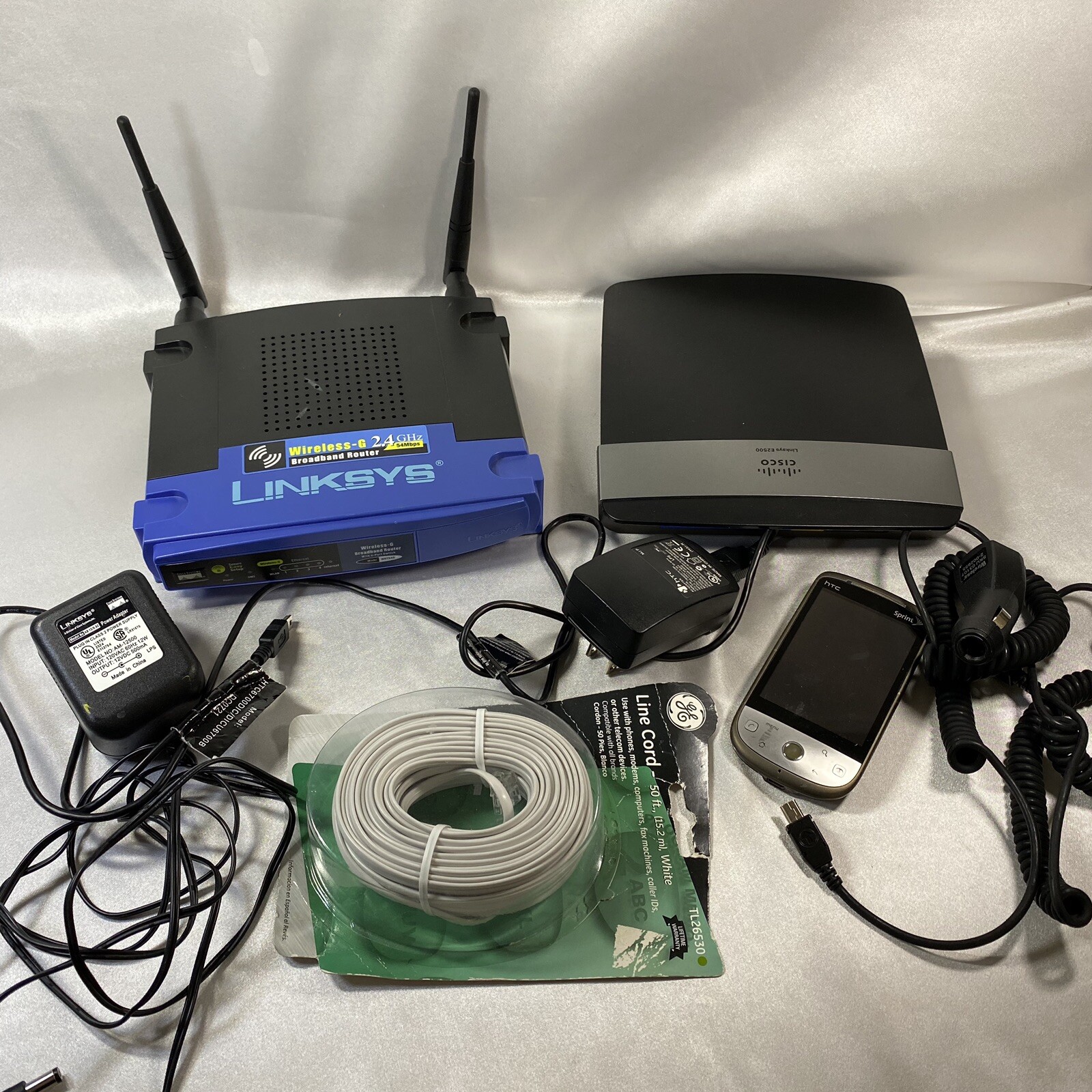 Junk Drawer Electronics Lot Linksys Router HTC Cell Phone Chargers Battery More
