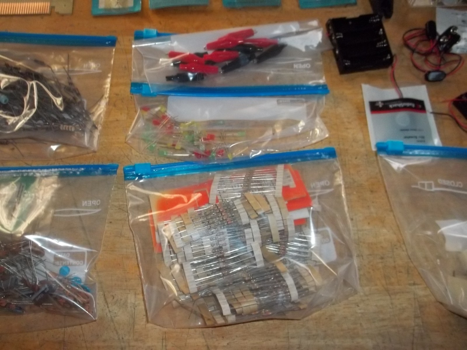 lot of electronics components, resistors, capacitors, relays, transistors, etc.