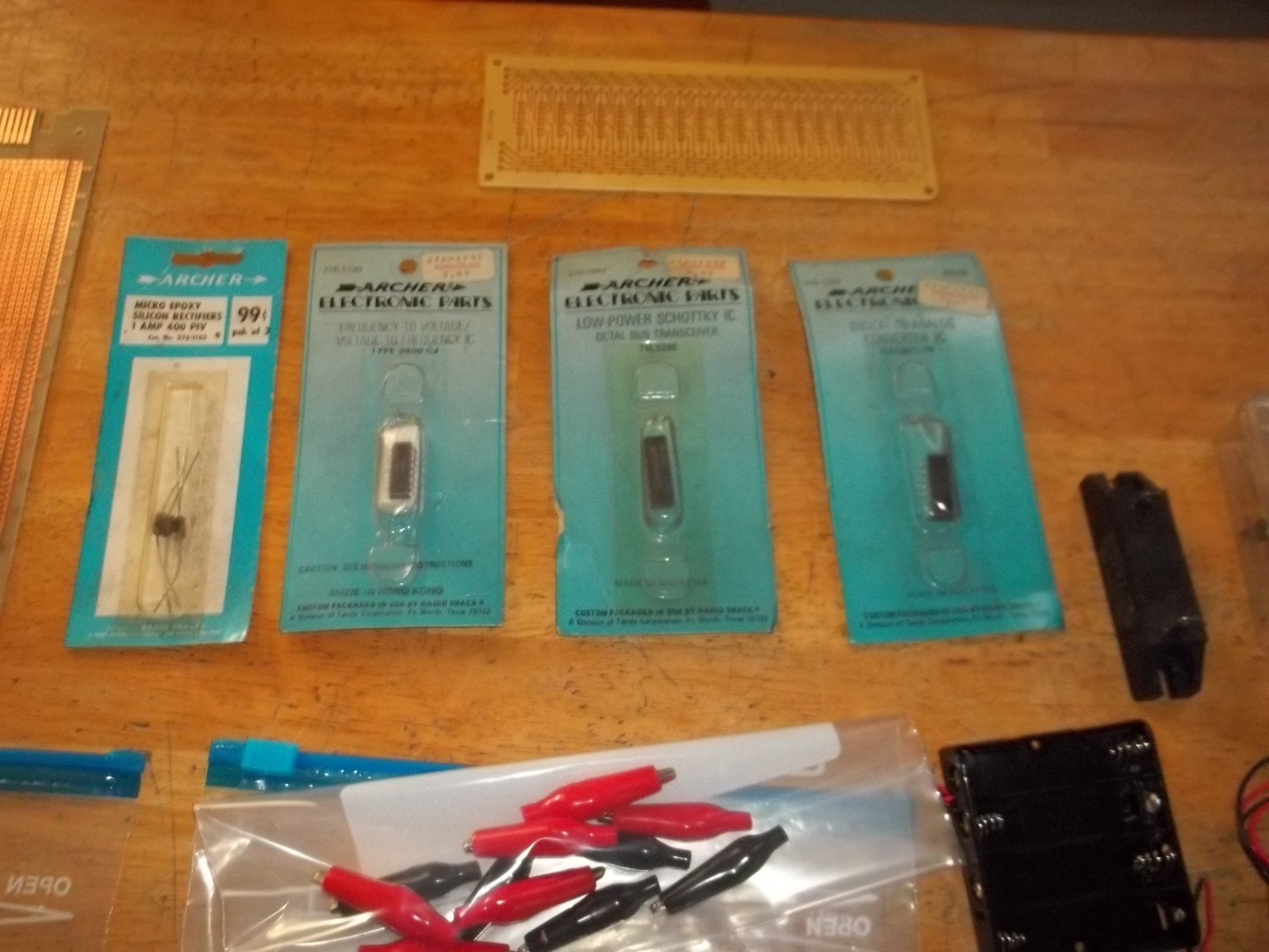lot of electronics components, resistors, capacitors, relays, transistors, etc.